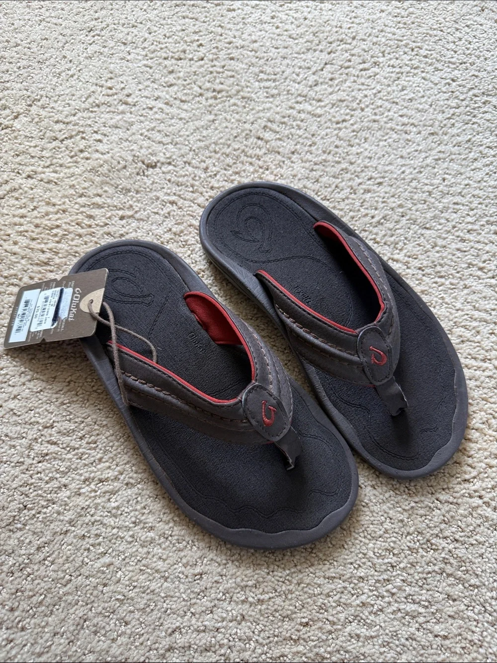 OluKai Hokua Dark Brown Flip Flops with Red Trim - Men’s 7